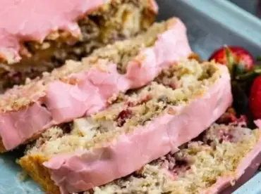 Sliced strawberry banana bread made with pancake mix on a brunch table.