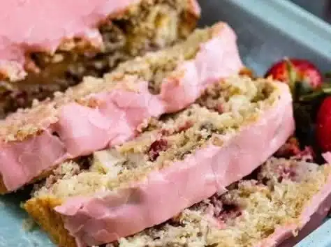 Sliced strawberry banana bread made with pancake mix on a brunch table.
