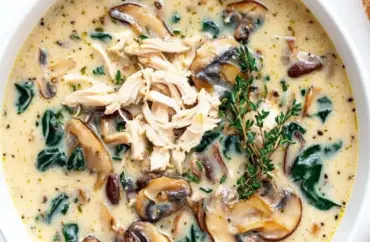 Comforting rotisserie chicken and mushroom soup in a bowl, perfect for chilly evenings.