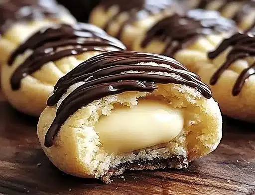 Soft baked Boston Cream Delights cookies with chocolate and cream filling