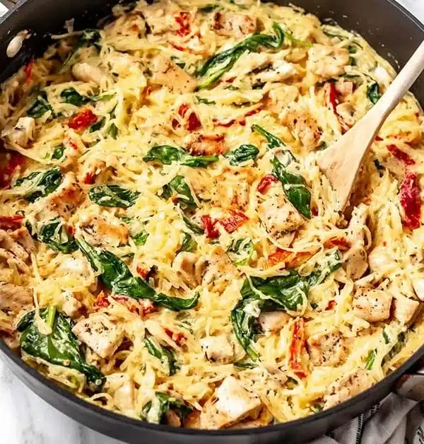 This recipe using spaghetti squash is a delicious low carb, gluten free alternative to traditional pasta dishes. Tuscan … | Tuscan spaghetti squash recipe, Chicken spaghetti squash recipe, Spaghetti squash low carb recipes